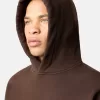 Felpa oversize con cappuccio e tasca a marsupio.