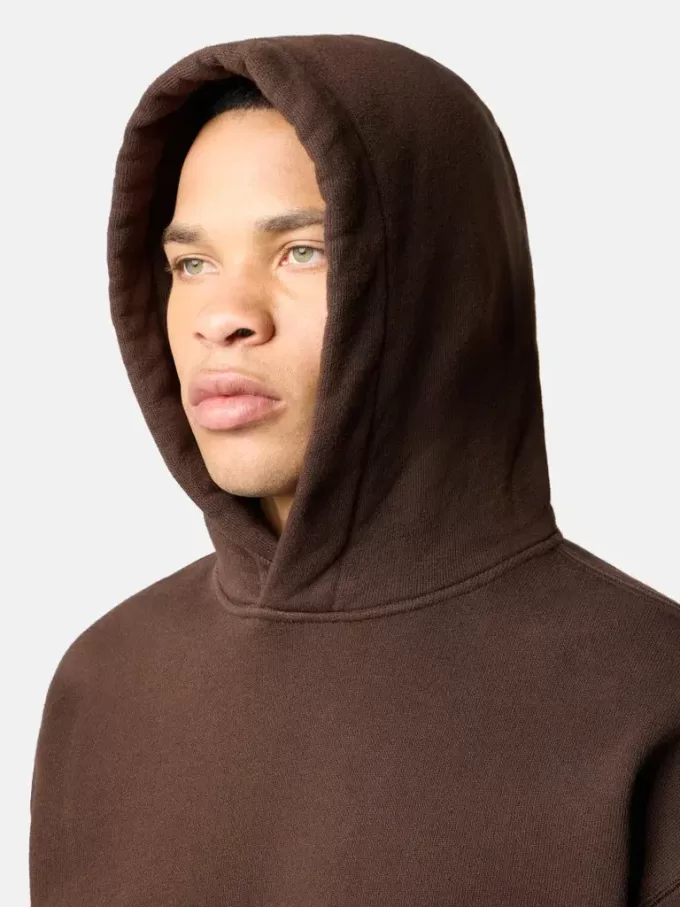 Felpa oversize con cappuccio e tasca a marsupio.