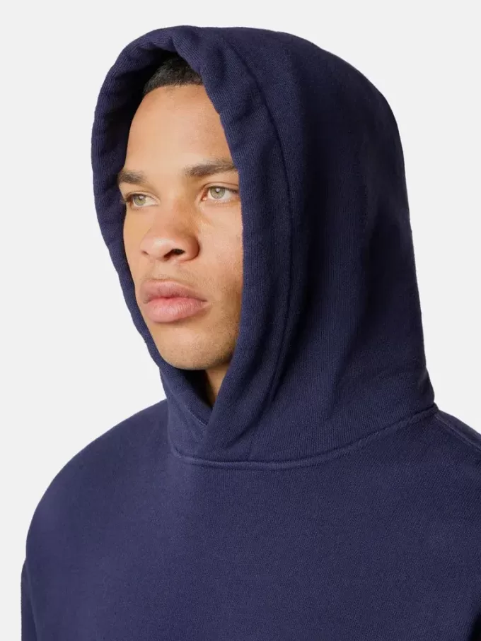Felpa oversize con cappuccio e tasca a marsupio.
