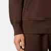 Felpa oversize con cappuccio e tasca a marsupio.
