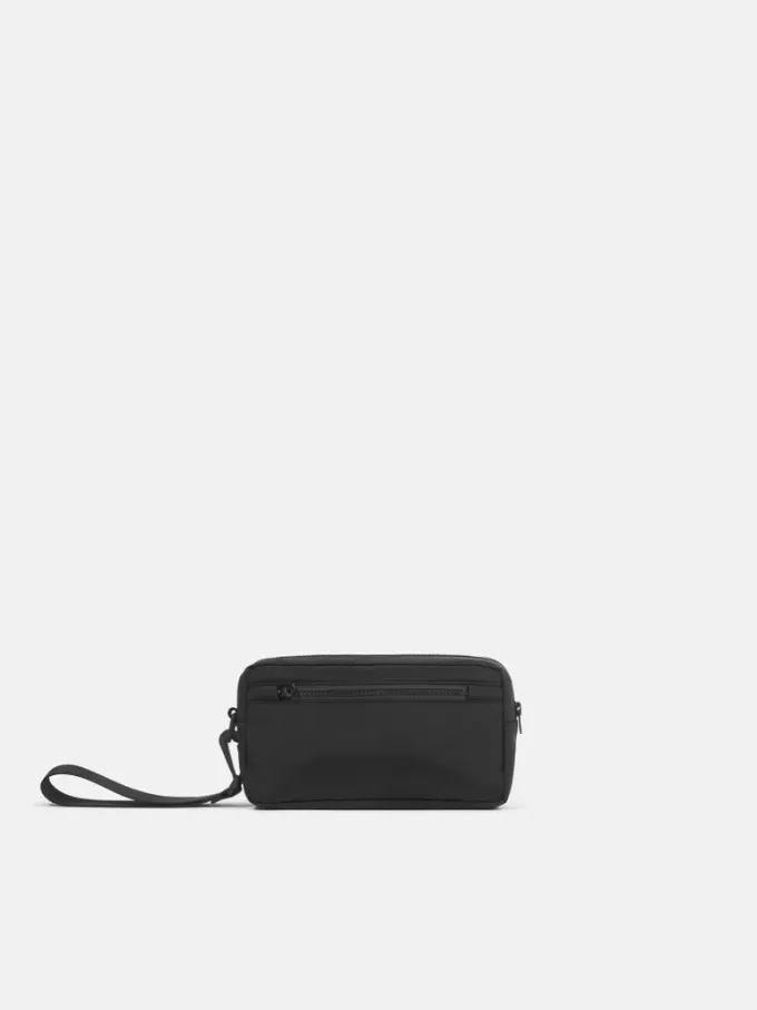 Pochette imbottita con cerniera, tasche e tracolla Pochette imbottita con cerniera, tasche e tracolla